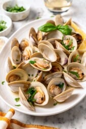 Platter of steamed clams with basil.