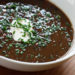 Black bean soup is a very hearty soup, super high in fiber, and so inexpensive to make. It's perfect topped with low fat sour cream and fresh chopped herbs such as chives, cilantro or scallions.