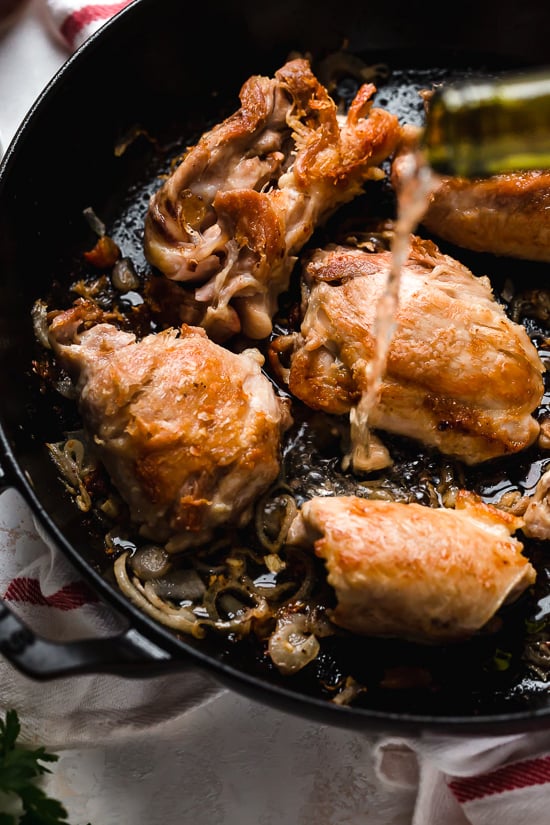 I lightened up this popular French chicken dish known as Poulet Au Vinaigre, which is made with chicken thighs and shallots cooked in red wine vinegar and white wine.