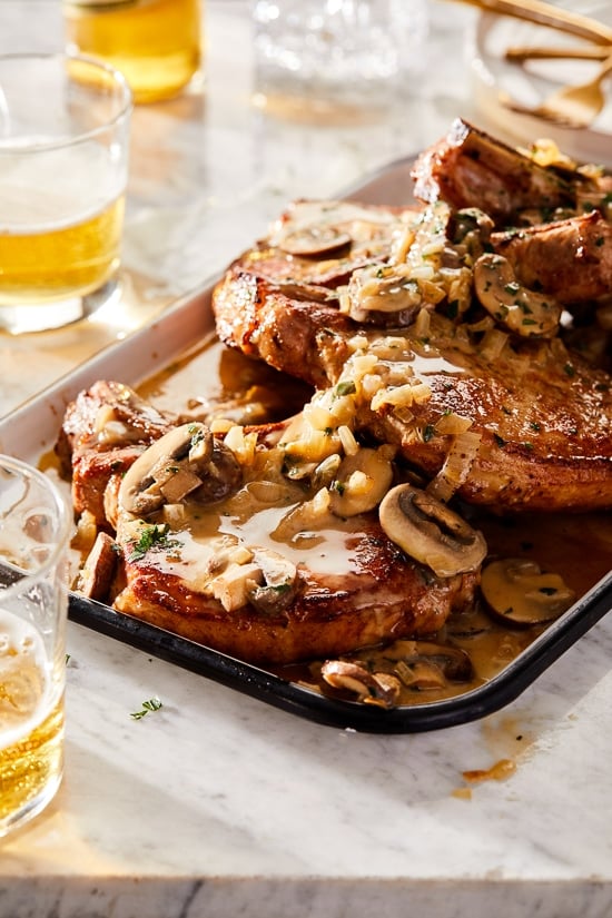 These Pork Chops with Mushrooms and Shallots are juicy and flavorful, made with a creamy Dijon sauce perfect for weeknight dinner!