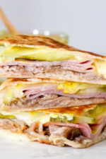 I made my favorite Cuban sandwich into a quesadilla filled with roast pork (pernil), ham, Swiss cheese, pickles, and mustard! Perfect for a quick lunch and a great way to use up my Slow Cooker Pernil.