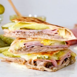 I made my favorite Cuban sandwich into a quesadilla filled with roast pork (pernil), ham, Swiss cheese, pickles, and mustard! Perfect for a quick lunch and a great way to use up my Slow Cooker Pernil.