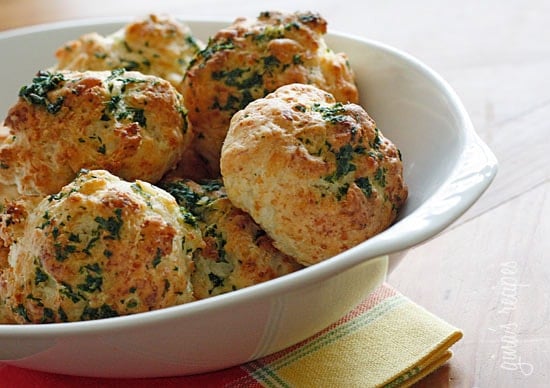 Super easy golden cheddar biscuits drizzled with garlic parsley butter. Make sure you have some company to enjoy these with, or you'll be tempted to eat them all!