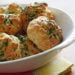 Super easy golden cheddar biscuits drizzled with garlic parsley butter. Make sure you have some company to enjoy these with, or you'll be tempted to eat them all!