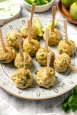 Baked southwest turkey meatballs with picks on plate.