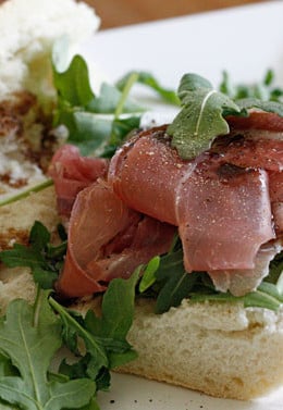 This prosciutto di Parma, peppery arugula, sweet balsamic and heart healthy olive oil on french bread is a winning combination.
