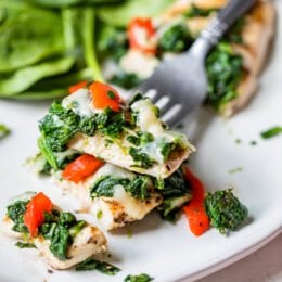 Grilled Chicken with Spinach and Melted Mozzarella on a fork