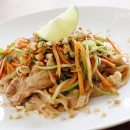 Asian Peanut Noodles with Chicken, Lightened Up is delicious, made with stir fried chicken strips, rice noodles, scallions, carrots, broccoli slaw, bean sprouts in a spicy peanut sauce. A winning combination of spicy, crunchy, sweet and salty will tantalize your taste buds.