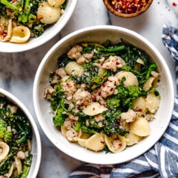Orecchiette Pasta with Sausage and Broccoli Rabe uses chicken sausage in place of pork and a whole lot of garlic! This lightened up version will not disappoint!!