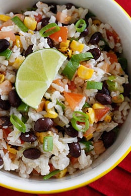 Rice, black beans, tomatoes, scallions, cilantro and lime juice, every bite of this colorful side dish will feel like one big fiesta in your mouth! Use leftover rice and this side dish comes together in minutes.