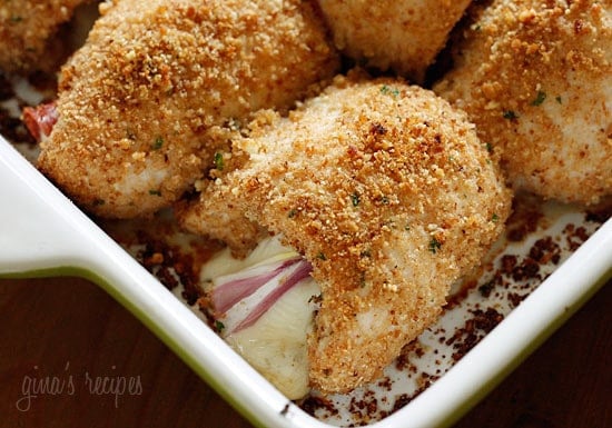 Chicken cutlets dipped in lemon and olive oil, gently coated in a combination of bread crumbs and romano cheese then rolled with prosciutto, cheese and red onion and baked until golden.