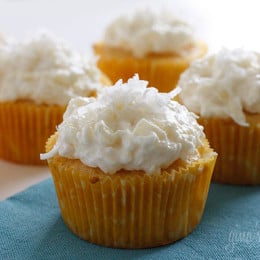 Pineapple and coconut top these light pineapple cupcakes, what a perfect Spring dessert! For the coconut lover out there, these are super easy, low fat, moist and delicious!