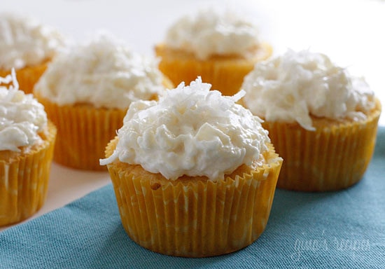 Pineapple and coconut top these light pineapple cupcakes, what a perfect Spring dessert! For the coconut lover out there, these are super easy, low fat, moist and delicious! 
