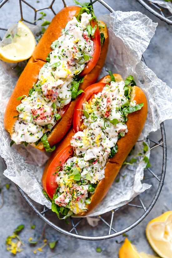 Lobster Rolls scream summer to me! Made with chunks of chilled lobster tossed with celery, shallots, chives, light mayonnaise and a little lemon zest served on a hot dog bun – delicious!