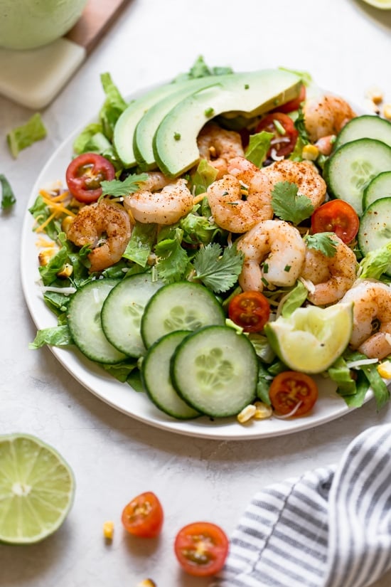 Shrimp Cobb Salad with avocados, grilled corn, black bean salsa, cucumbers, tomatoes and cheese.