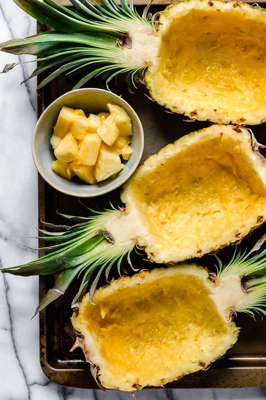 Hollowed out pineapples for serving fried rice.