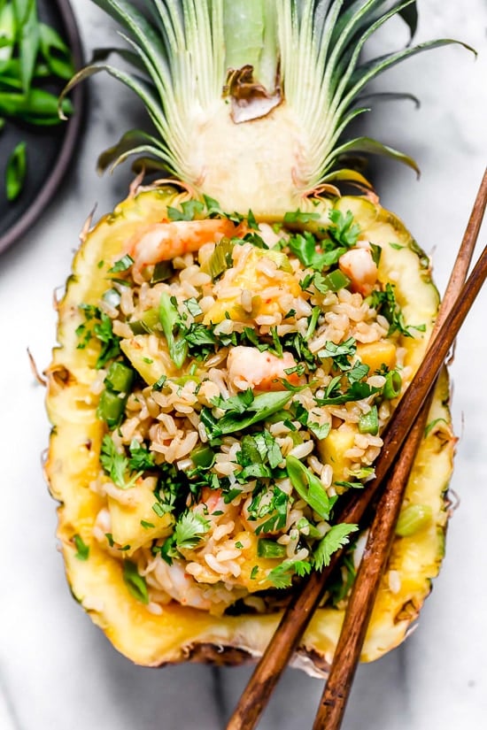 Pineapple Shrimp Fried Rice has a delicious flavor combination of savory, sweet and spicy. Serve it in hollowed out pineapples for a beautiful presentation!