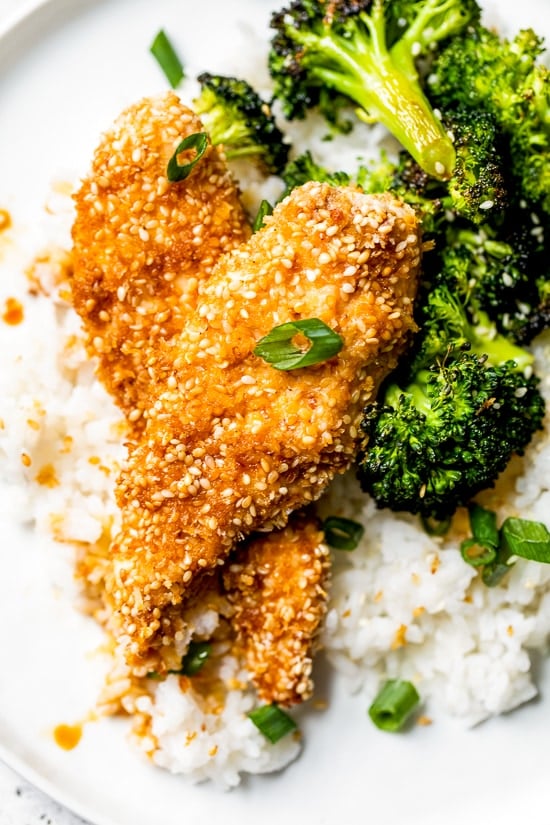 If you like the taste of sesame seeds as much as I do, you'll love these Sesame Encrusted Chicken Tenders coated with sesame seeds, panko and a hint of soy sauce. Bake them or make them in the air fryer!