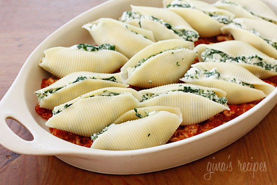 Jumbo pasta shells stuffed with ricotta cheese, mozzarella and spinach topped with a turkey meat sauce. Here's a great way to sneak spinach on your kids' plate!