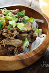 Boneless pork roast slow cooked in Asian spices creates a aromatic pork dish with mushrooms and broth, perfect over noodles or rice with fresh chopped green onions, cilantro and sriracha.