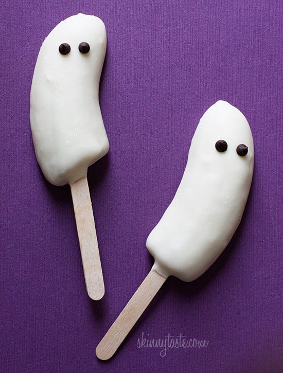 frozen banana ghost with white chocolate, see more at //homemaderecipes.com/healthy/16-halloween-treats/