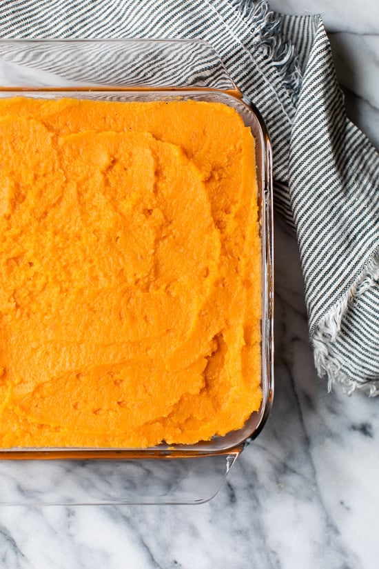 Mashed Sweet Potatoes Brulee are seasoned with with a hint of cinnamon and nutmeg topped with a caramelized brown sugar crust.