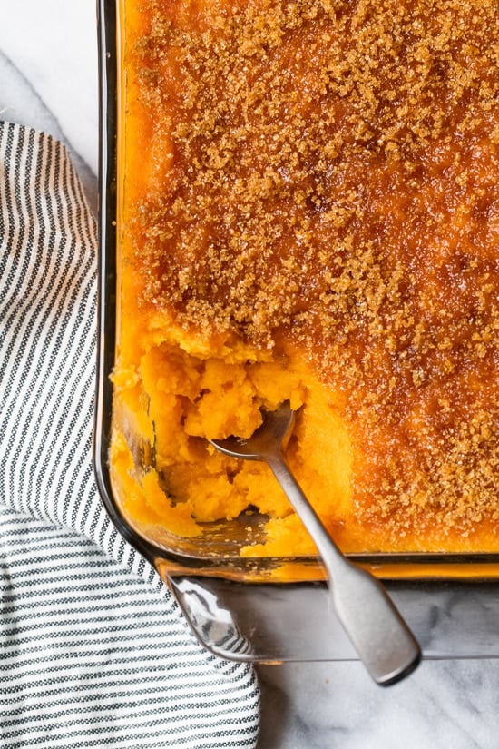 Mashed Sweet Potatoes Brulee are seasoned with with a hint of cinnamon and nutmeg topped with a caramelized brown sugar crust. Sweet potatoes are a must for Thanksgiving and this dish will be a hit on your Holiday table.