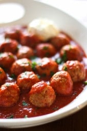 Slow cooker Italian turkey meatballs with tomato sauce in a large serving dish.