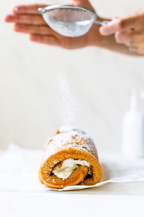 This classic pumpkin roll recipe is made lighter than traditional recipes with a delicious pumpkin spiced sponge cake and a light cream cheese filling.
