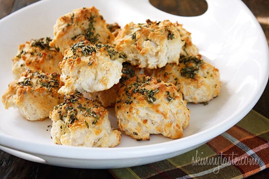 The scent of Garlic + Rosemary + Baked Bread is absolutely intoxicating to me. Seriously, my stomach starts to growl just thinking about it. I've always been more of a savory girl; I can bake a dozen cupcakes and not eat one, but place a batch of these biscuits in front of me... different story.