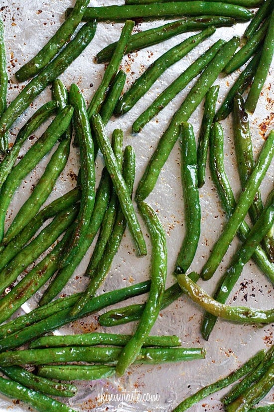 Roasted Green Beans topped with Parmesan come out perfectly charred and tender – SO good, I can literally eat the whole batch and made with just four ingredients!