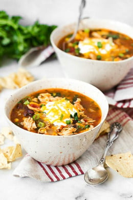 Chicken Enchilada Soup has everything you love about chicken enchiladas... in one big bowl of soup!