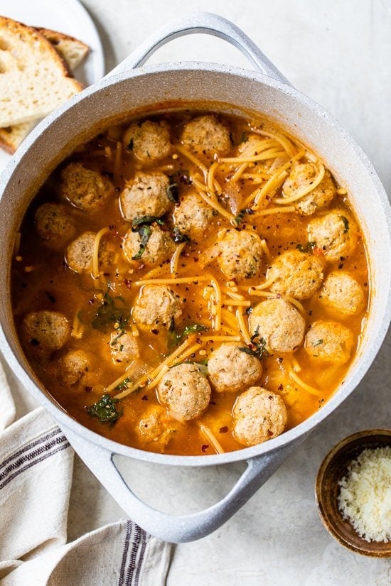 Pot of spaghetti soup with meatballs