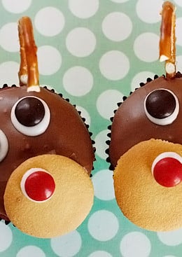 Red velvet yogurt cupcakes topped with a chocolate glaze. These festive reindeer cupcakes are easy to make perfect for a Holiday party!