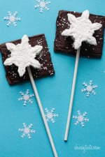 Smores Pops – Chocolate graham crackers coated with melted chocolate and marshmallows on a stick. A fabulous winter treat whether you want to make them as favors or just have fun making them with the kids.