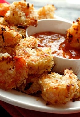 These Easy Baked Coconut Shrimp are crisp, golden and delicious served a sweet and spicy apricot dipping sauce. Set these out on a platter in front of some hungry guests and I guarantee they will disappear!!