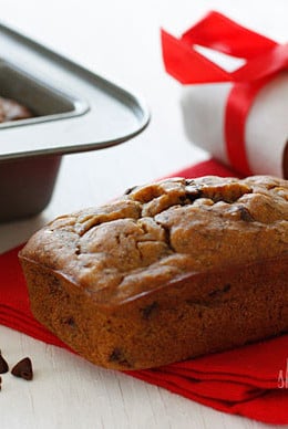 Whole wheat mini banana bread made with ripe bananas and chocolate chips are sure to leave a smile on anyone's face.