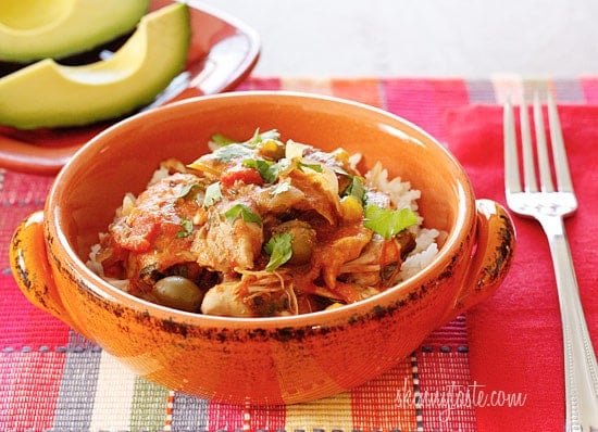 Chicken a la Criolla, a simple yet flavorful Latin dish made with stewed boneless skinless chicken thighs bell peppers, onions, garlic, tomatoes, olives, cilantro and spices. Slow cooker or Instant Pot directions provided.