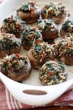 Spinach and Bacon Stuffed Mushrooms stuffed with sautéed baby spinach, chopped mushrooms, bacon, bread crumbs and Parmesan cheese – a lighter alternative to traditional stuffed mushrooms yet loaded with tons of flavor!