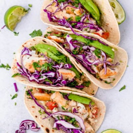 These easy Cilantro Lime Fish Tacos are made with flaky white fish, tomatoes, jalapeños, cilantro and lime topped with avocado.