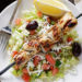 Marinated chunks of grilled chicken breast served over a bed of lettuce with feta, fresh diced tomatoes, cucumbers, green peppers, black olives, red onions, parsley and dill tossed in olive oil and fresh lemon juice.
