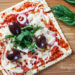 A matzo cracker makes a great base for a pizza that kids and adults will love for Passover! Top it with your favorite vegetables and cheese and you have yourself a quick meal.