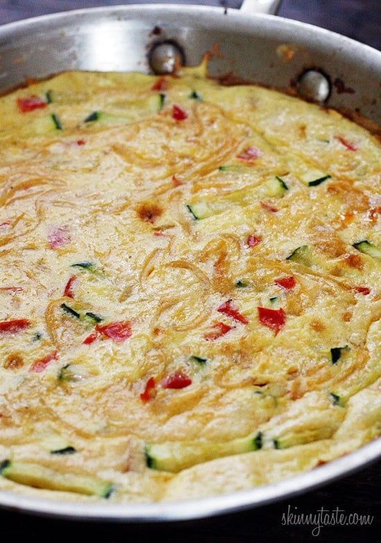 Caramelized onions, sauteed red bell peppers and zucchini combined create a winning egg frittata breakfast dish.