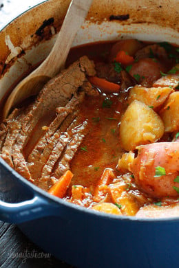 Lean beef brisket slowly braised in the oven with potatoes, carrots and onions. Perfect for Passover or Easter dinner. Slicing the brisket half-way through cooking assures that the meat is tender and flavorful.
