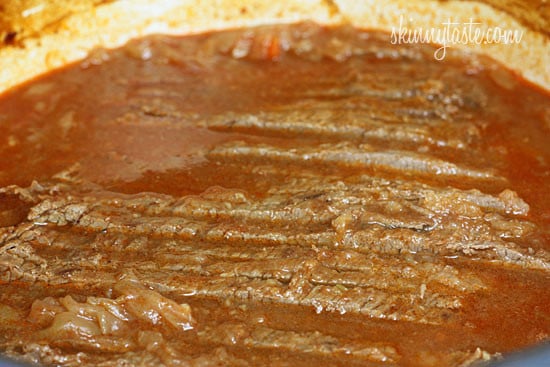 Lean beef brisket slowly braised in the oven with potatoes, carrots and onions. Perfect for Passover or Easter dinner. Slicing the brisket half-way through cooking assures that the meat is tender and flavorful.