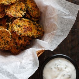 Cornmeal panko herb crusted dill pickles baked in the oven until golden and crisp with a light buttermilk ranch dip. Have you ever had fried pickles?