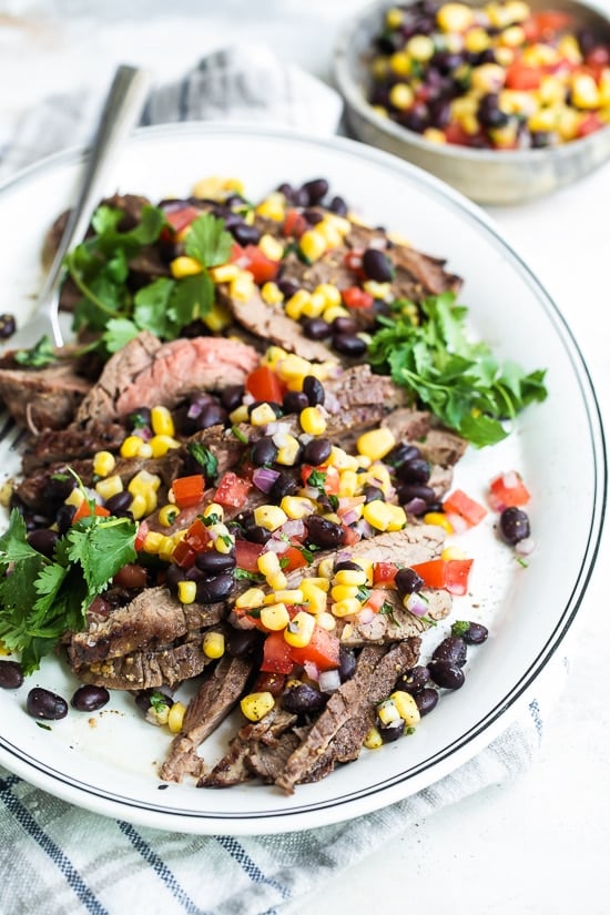 Grilled flan steak with black beans and corn sauce
