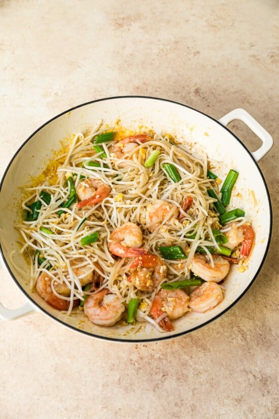 Shrimp and noodles in wok after adding bean sprouts