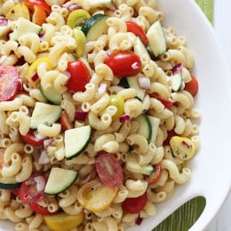 Macaroni Salad with Tomatoes and Zucchini is the perfect summer pasta salad loaded with fresh summer vegetables tossed in a light creamy dressing.