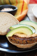 One bite of this spicy black bean burger with spicy chipotle mayo and creamy avocado and you won't miss the meat! Yes, these were good enough to please even the adult carnivore's in my home (a bit too spicy for my kids).